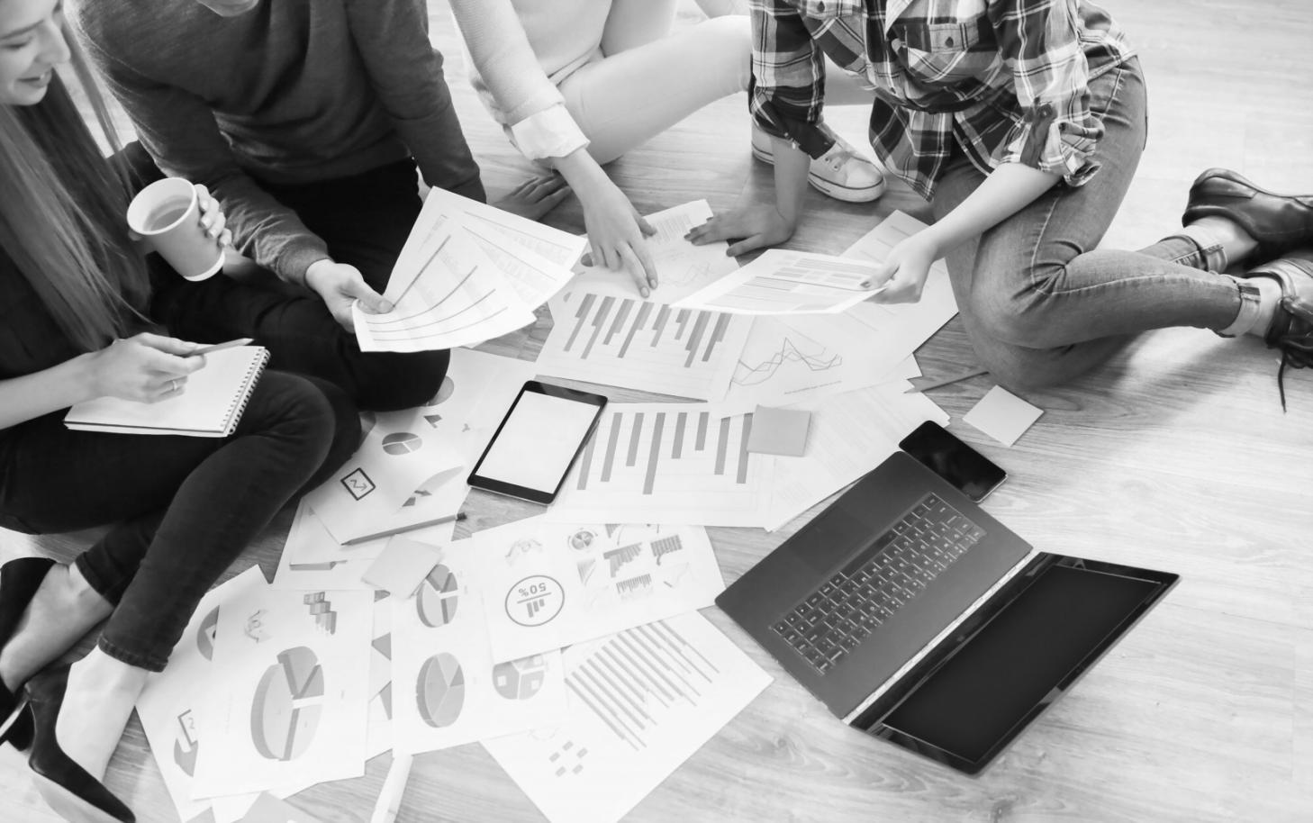 Modern workspace with financial planning materials and startup documentation